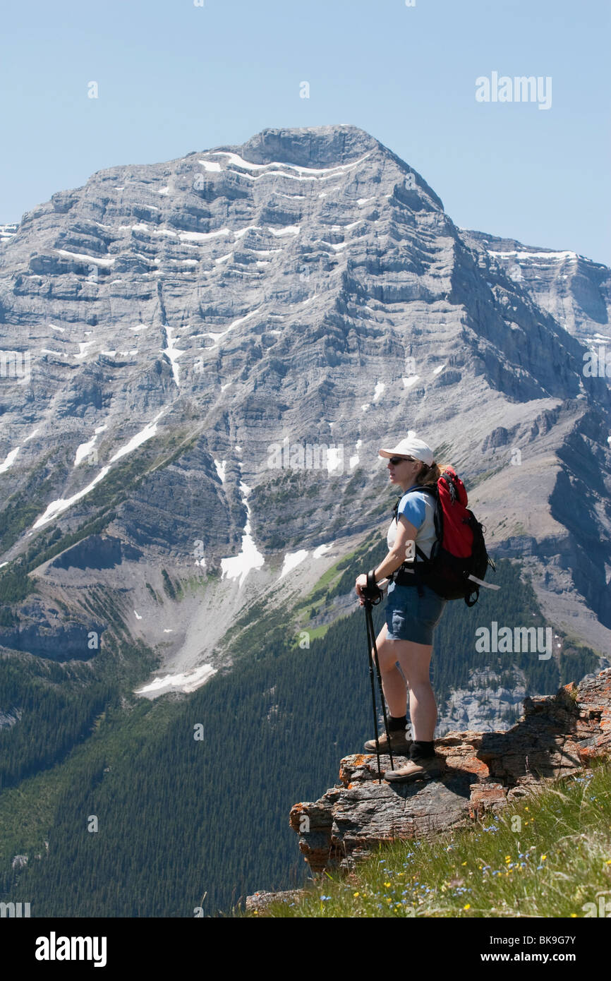 Woman Standing On The Top Of A Mountain Stock Photo - Alamy