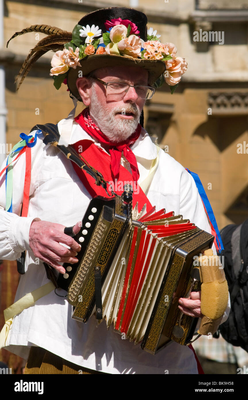 Morris musician playing dance tunes on a melodeon to accompany the morris dancing at the Oxford Folk festival Stock Photo