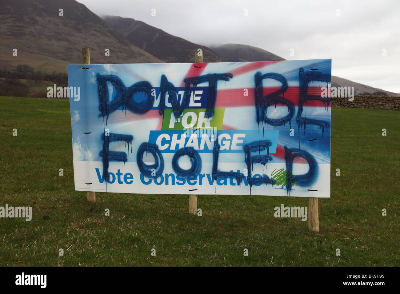 Tory Political Election Campaign Sign for the Conservative Party that Has Been Spray Painted with the Message 'Don't Be Fooled' Stock Photo