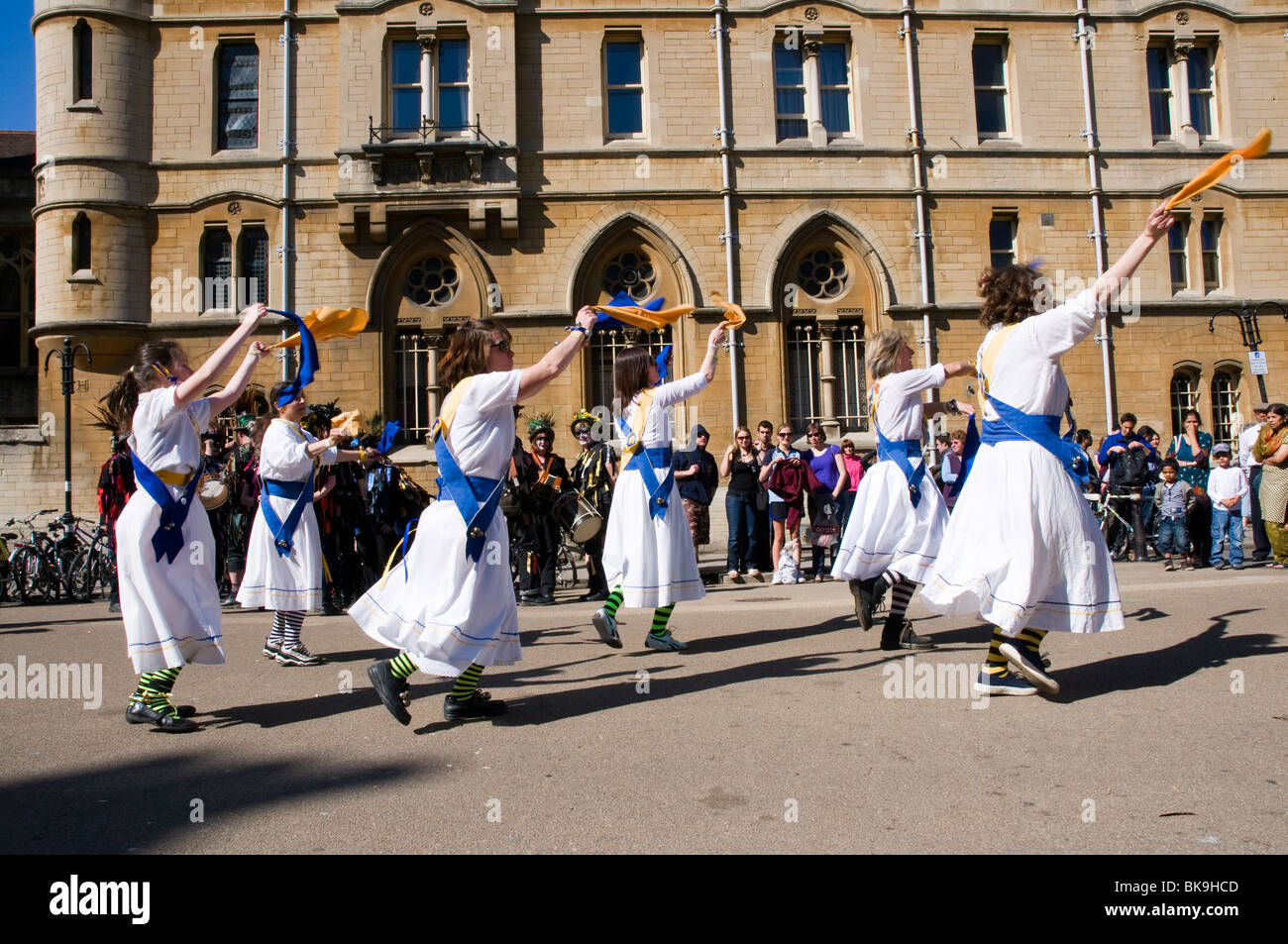 Morris dancers in action at the Oxford Folk Festival, dancing on Broad Street in front of