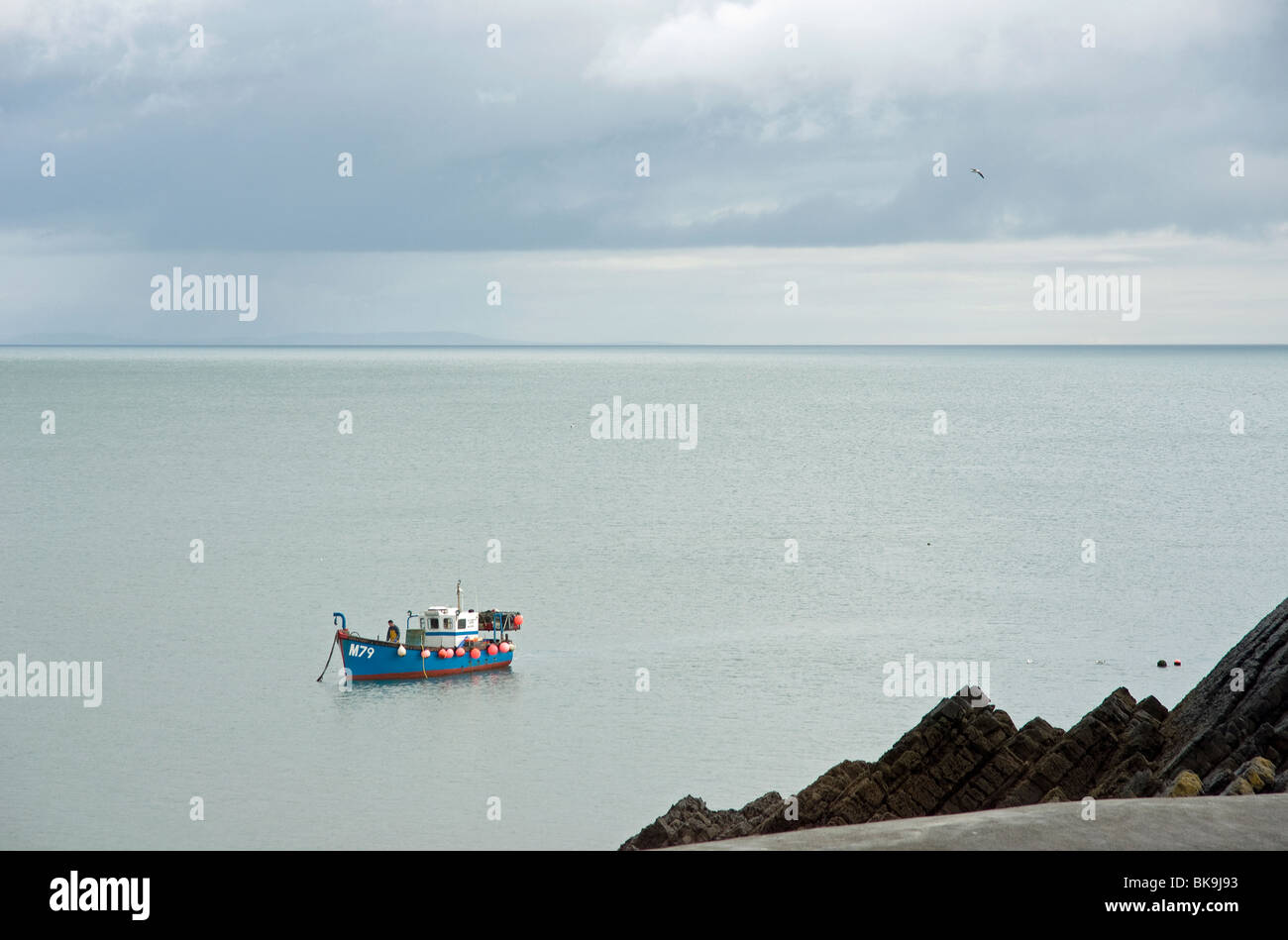 A fishing boat off Stackpole Quay near Barafundle Bay in Pembrokeshire ...