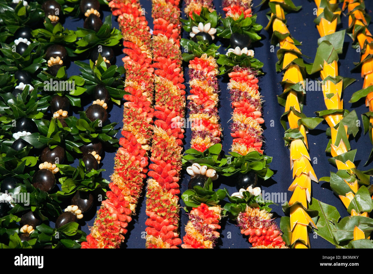 Floral leis and haku ready for sale by vendors at Merrie Monarch Festival in Hilo, Hawaii. Stock Photo