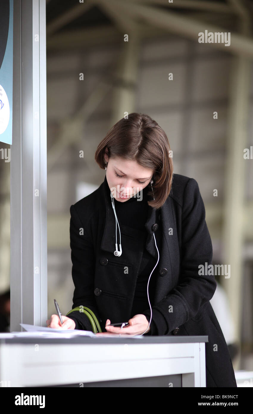 A woman fills in a registration form Stock Photo