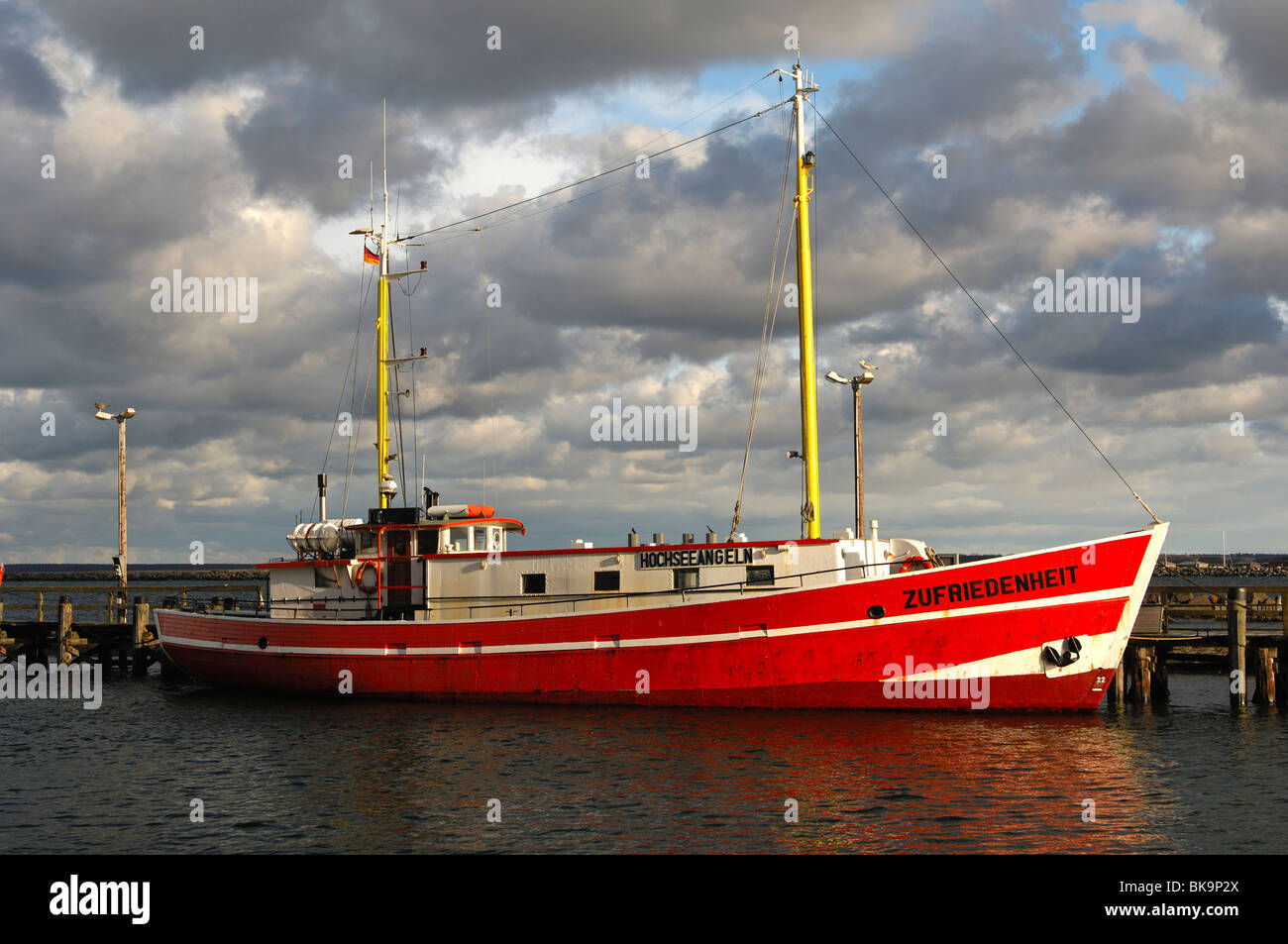 Deep water fishing ship Zufriedenheit, Satisfaction, moored at the pier of the Rostock-Warnemuende port, Germany Stock Photo