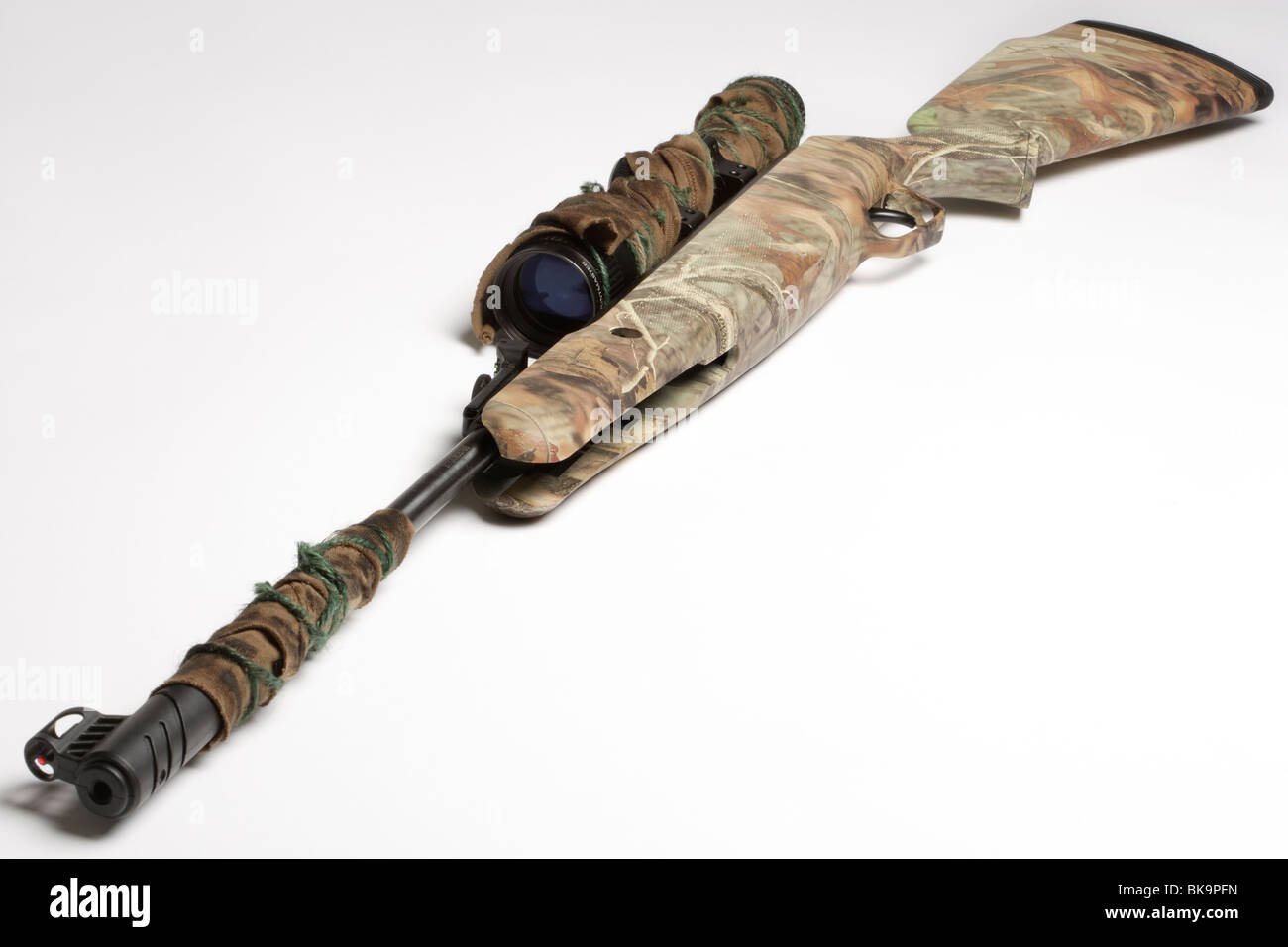 Camouflage air rifle gun with telescopic sights and a stand Stock Photo