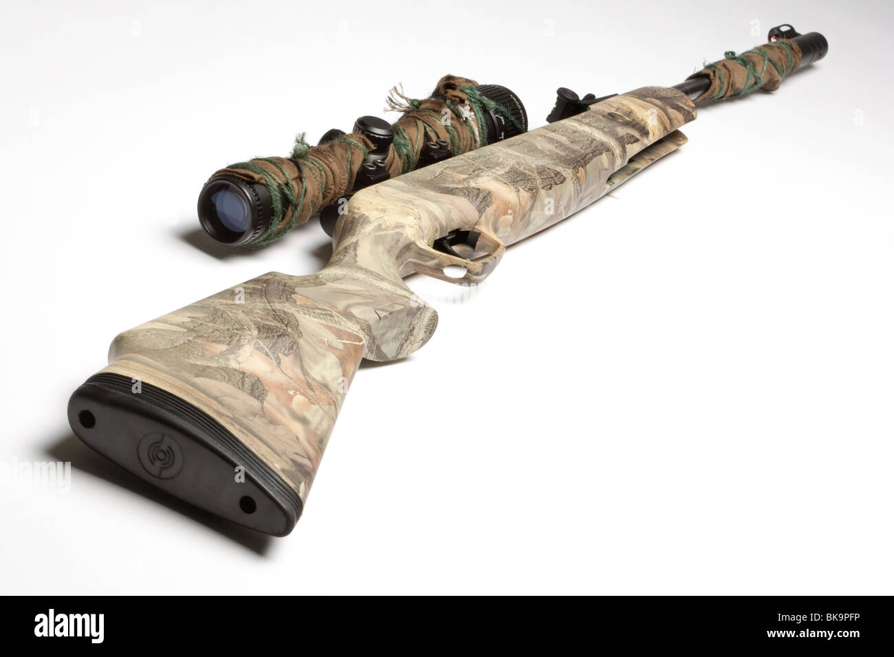 Camouflage air rifle gun with telescopic sights Stock Photo