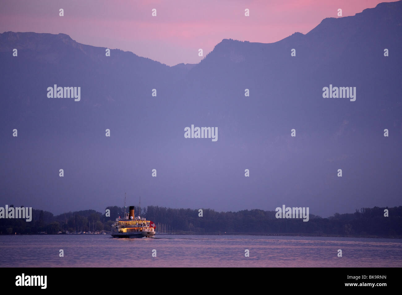 Excursion boat on Lake Geneva arriving Chillon Castle, Veytaux, Vaud, Switzerland Stock Photo
