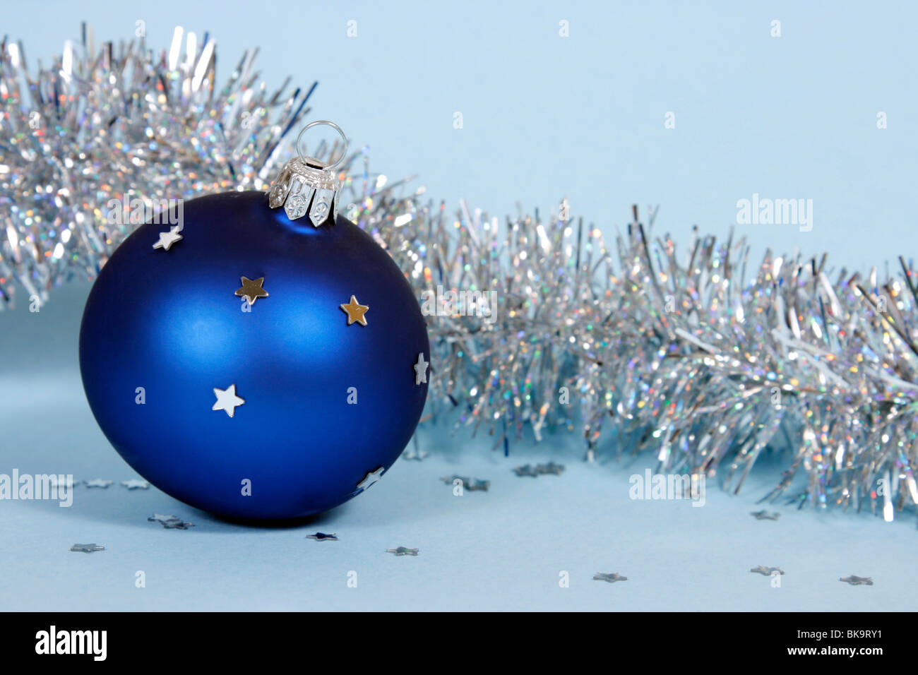 Blue Christmas ball on the blue background Stock Photo - Alamy