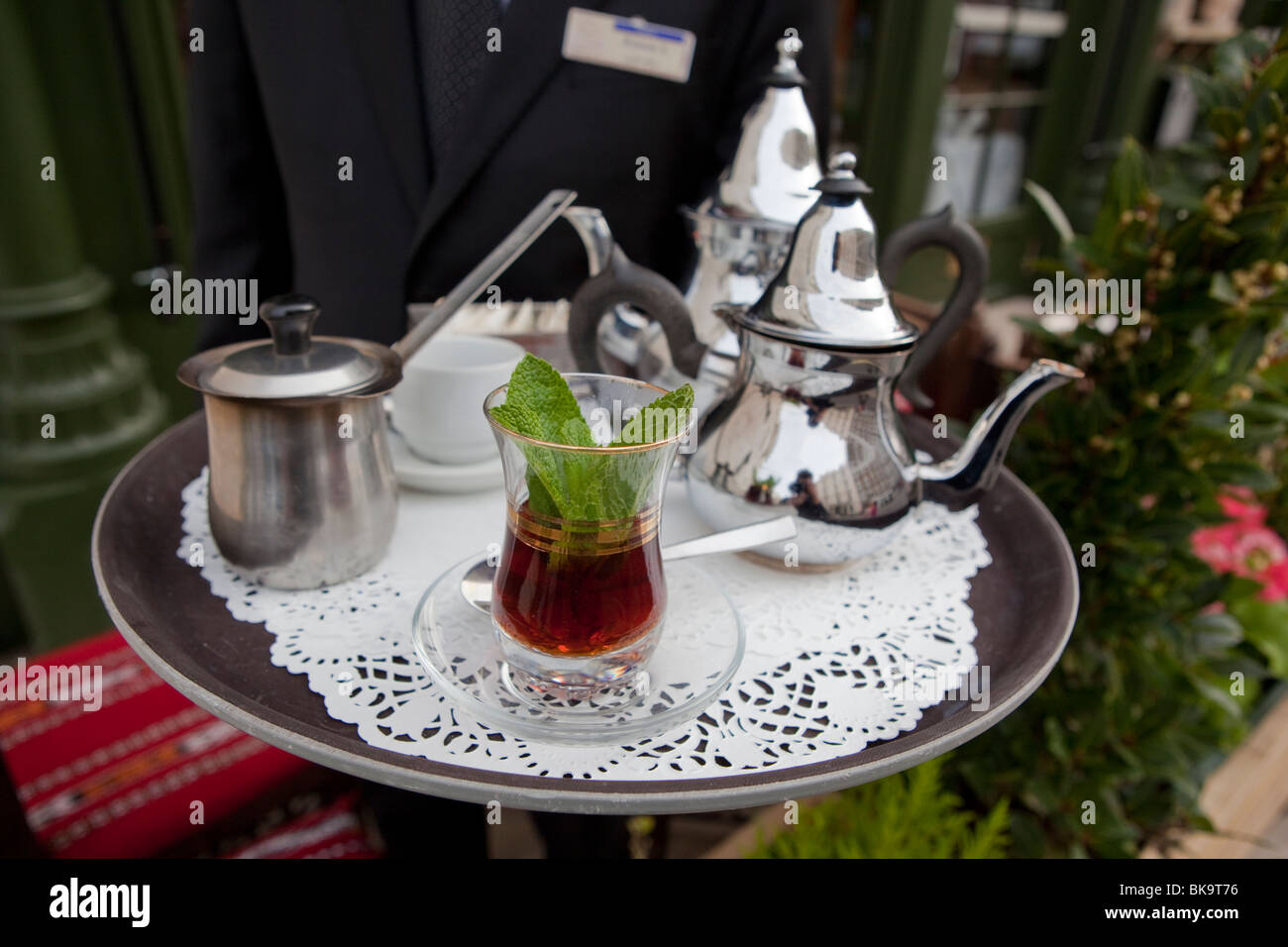 A waiter serves mint tea at Assaha restaurant in London. (W2) Stock Photo