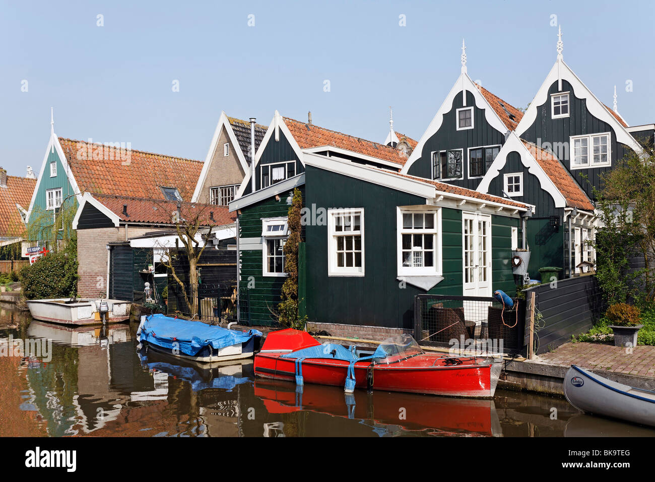 Typical wooden houses from the 17th century at a canal, historic city De Rijp near Alkmaar, Province of North Holland, Netherla Stock Photo