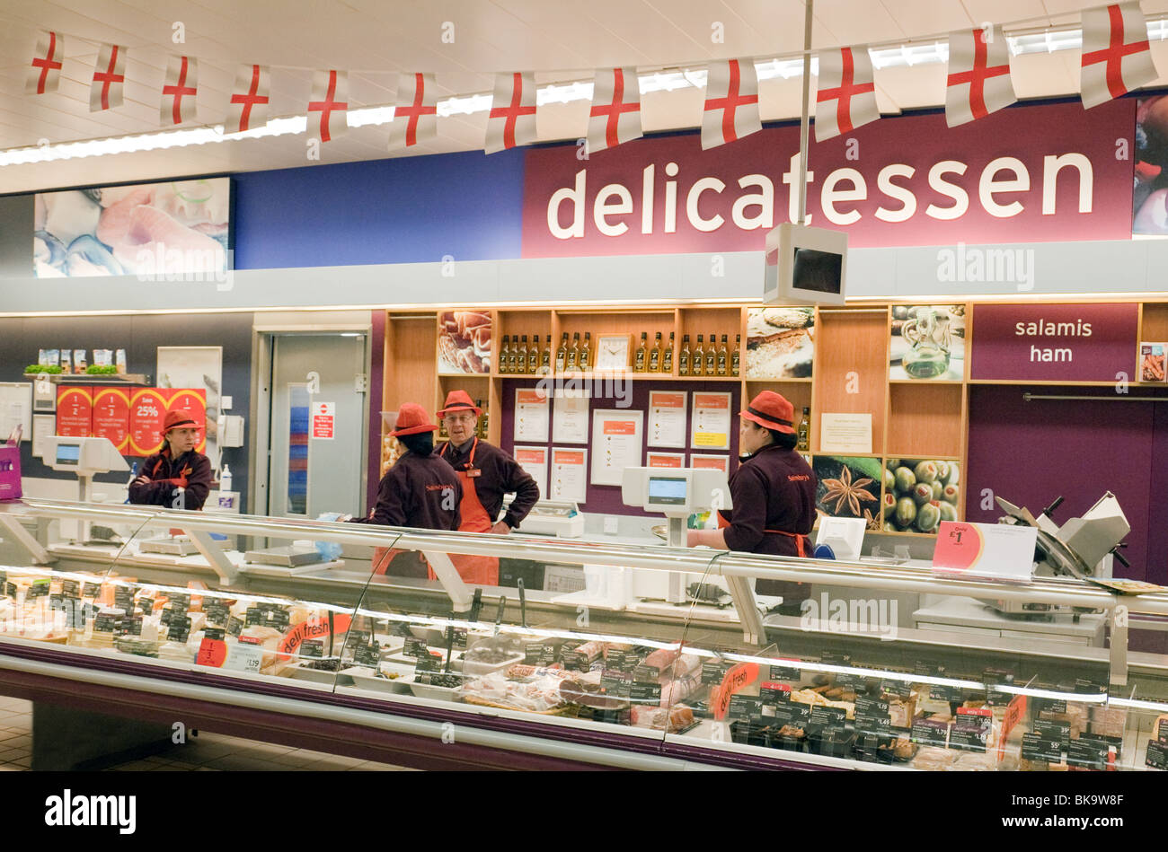 Delicatessen UK; The Delicatessen and Sainsburys staff, the interior of Sainsburys Supermarket deli, Chislehurst, Kent, UK Stock Photo