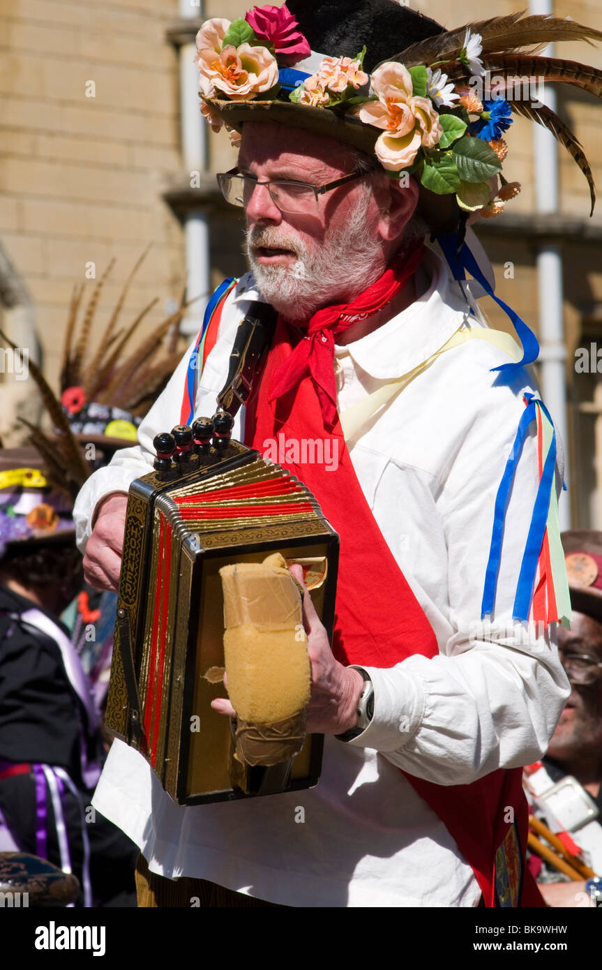 Morris musician playing dance tunes on a melodeon to accompany the morris dancing at the Oxford Folk festival Stock Photo