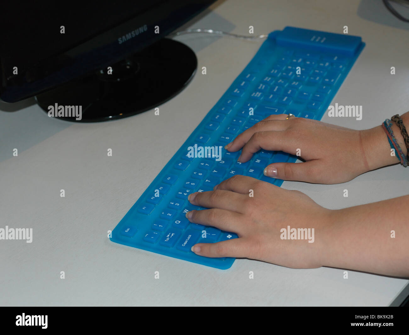 Hands On Blue Plastic Flexible Keyboard Stock Photo Alamy