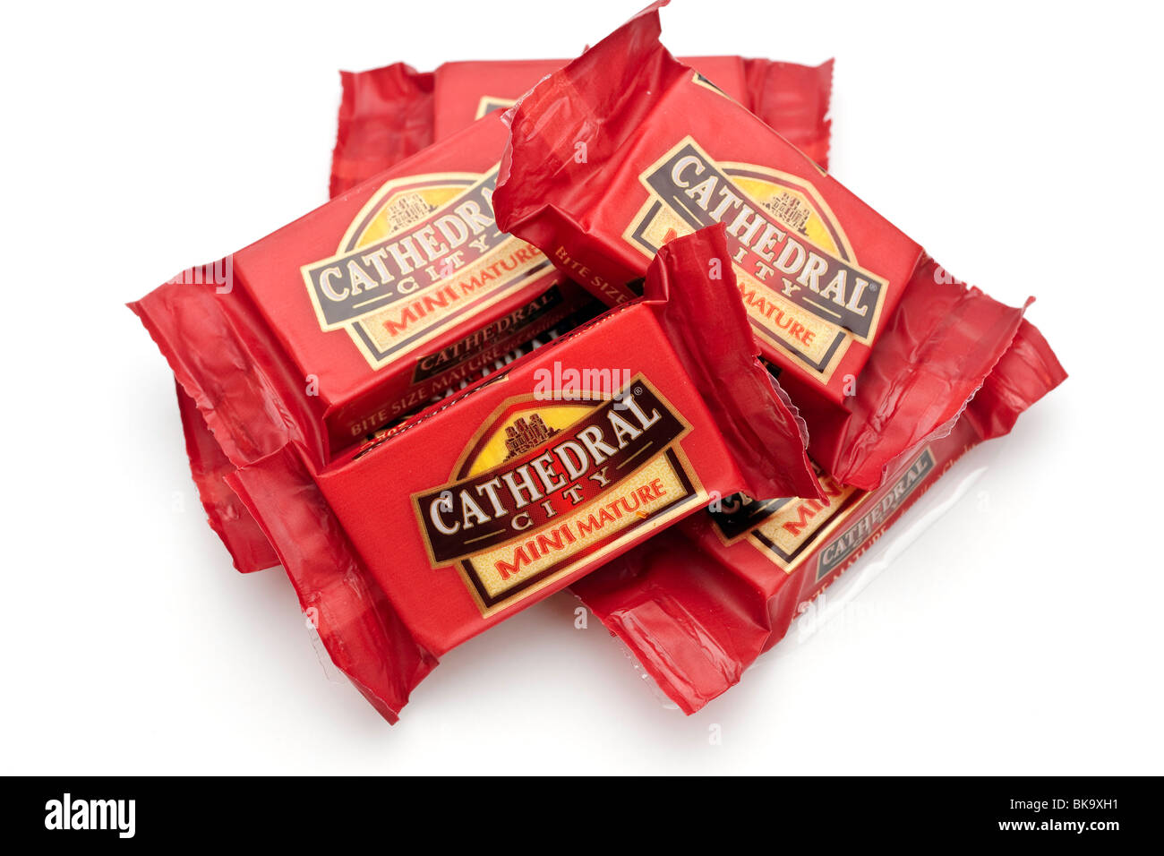 Pile of individually wrapped portions of 'Cathedral City'  mini mature mellow cheddar cheese Stock Photo