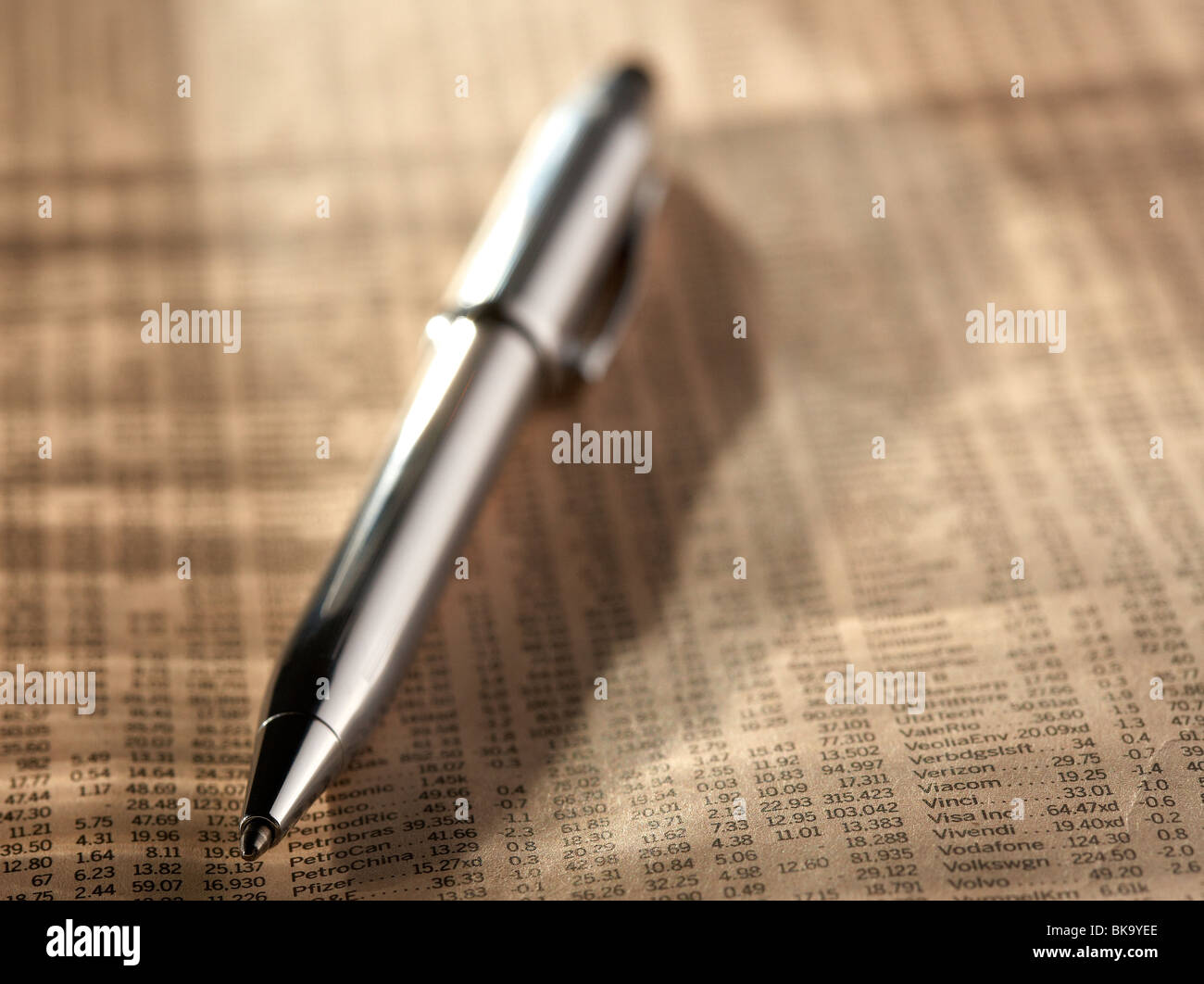 silver pen on share prices Stock Photo