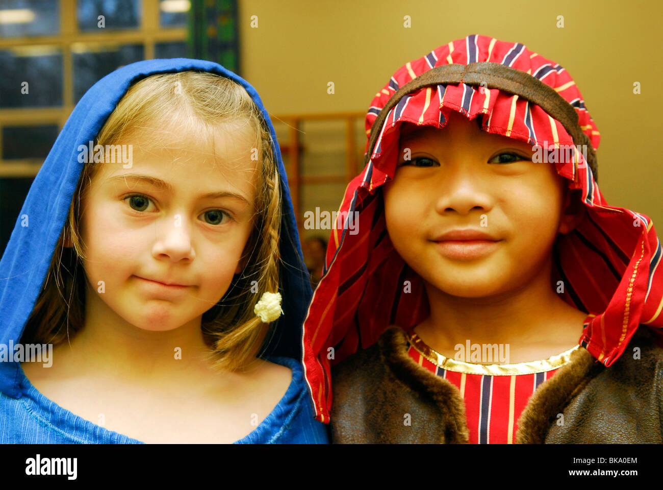 Two youngsters dressed as Mary and Joseph for their school's nativity play, Hampshire, UK. Stock Photo