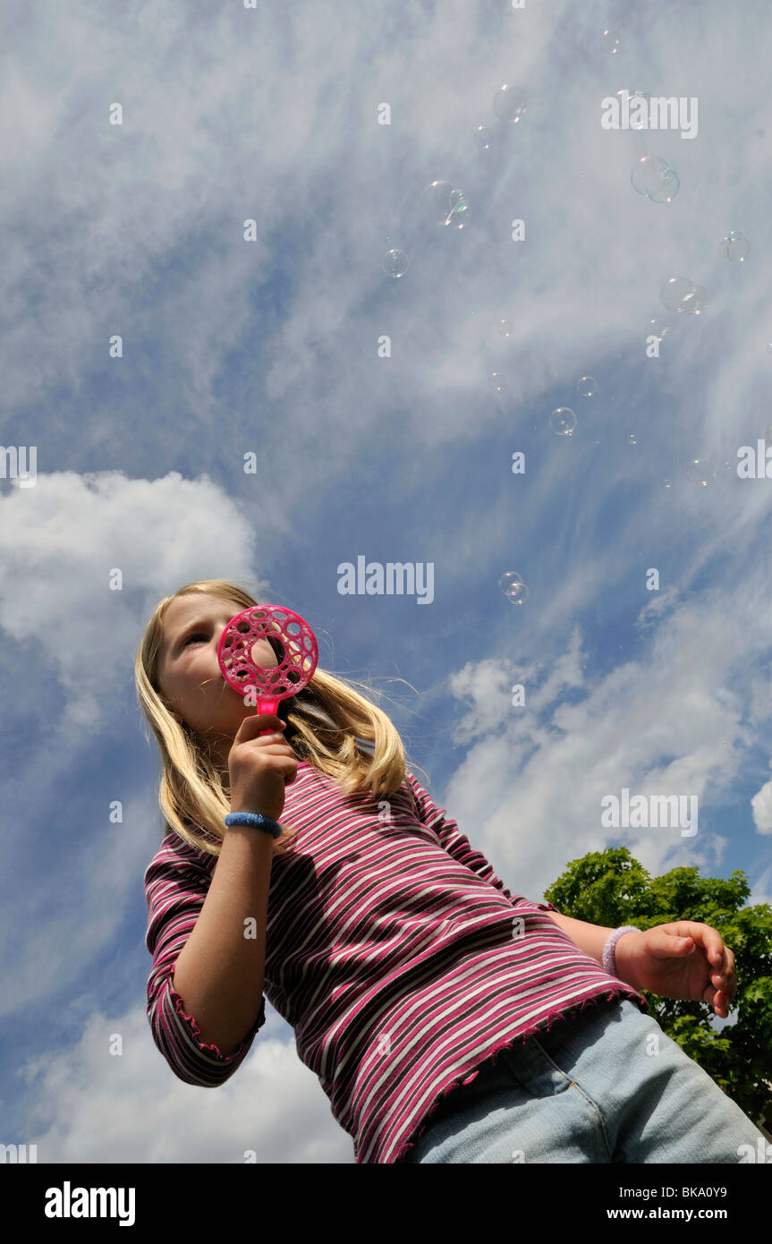Girl blowing bubbles, Norrkoeping, Ostergotlands Lan, Sweden Stock Photo