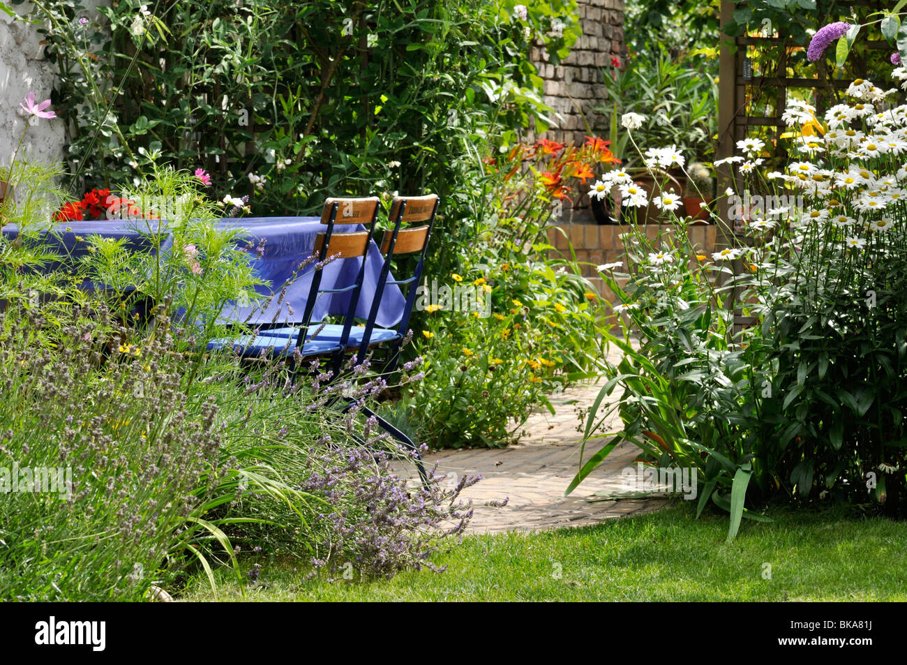 Seating area in a backyard garden. Design: Jutta Wahren Stock Photo