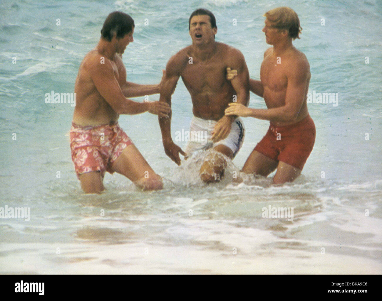 BIG WEDNESDAY (1978) GARY BUSEY, JAN-MICHAEL VINCENT, WILLIAM KATT BWDY 001CP Stock Photo