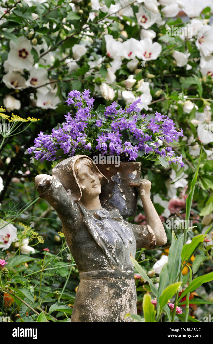 Bellflower (Campanula) with female figure. Design: Jutta Wahren Stock Photo