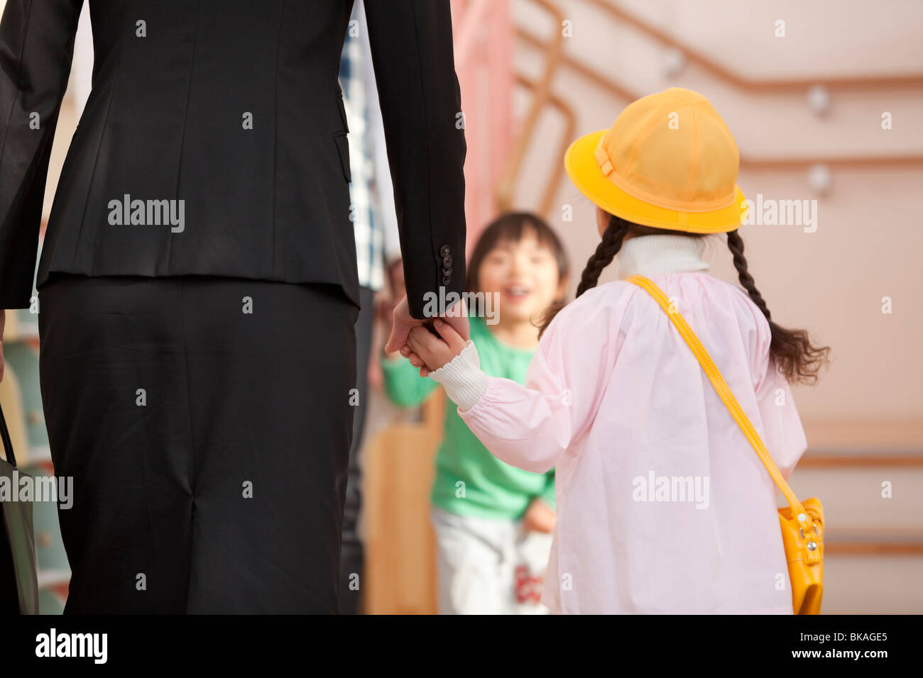 Working Woman Dropping Daughter off Day-care Center Stock Photo