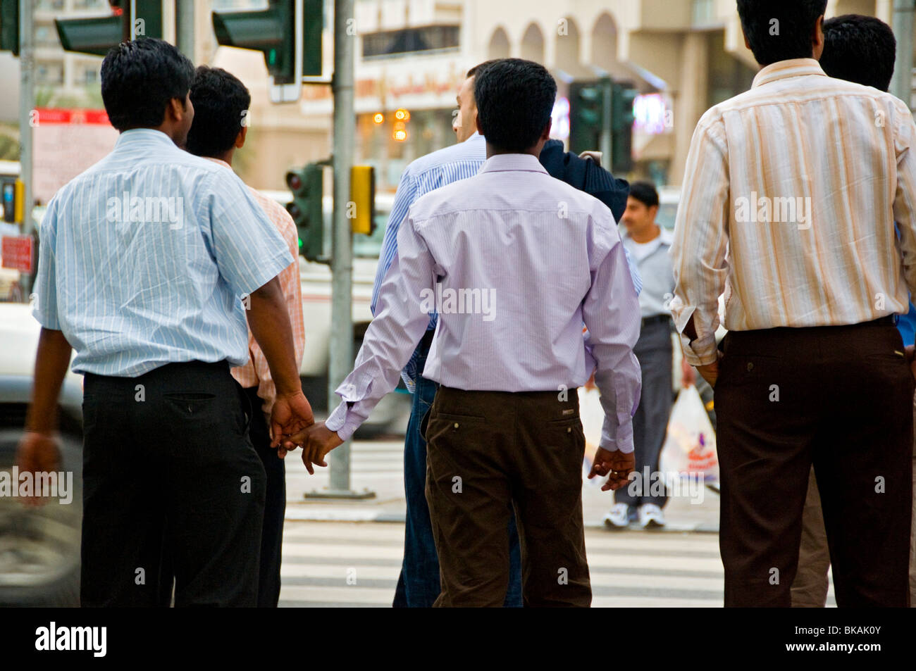 Men holding hands Dubai Stock Photo