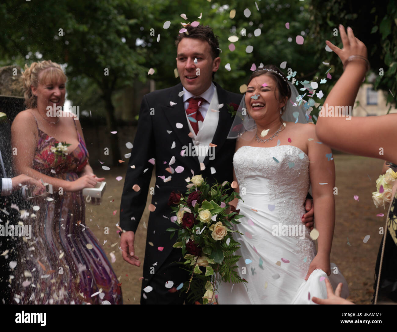 Wedding Throwing Confetti Over Bride And Groom Peterborough England Stock Photo Alamy