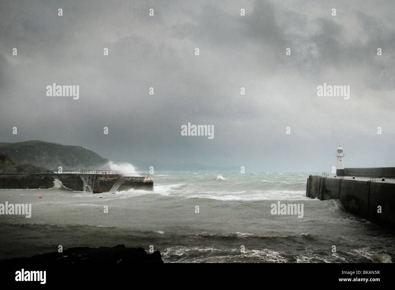 lighthouse by stormy sea at Mevagissey, Cornwall Stock Photo