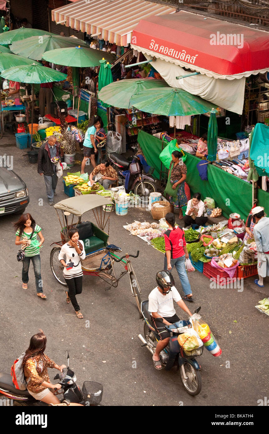 Marketplace vendors on a street near Chinatown and Ping River, Chiang Mai, Thailand. Stock Photo
