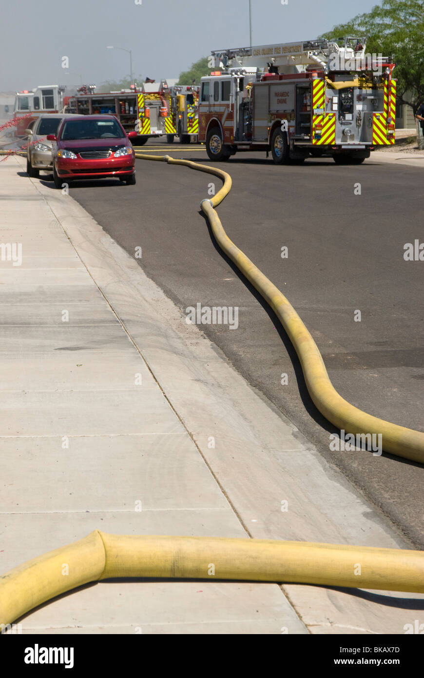 firefighters respond to a house fire in a residential area Stock Photo ...