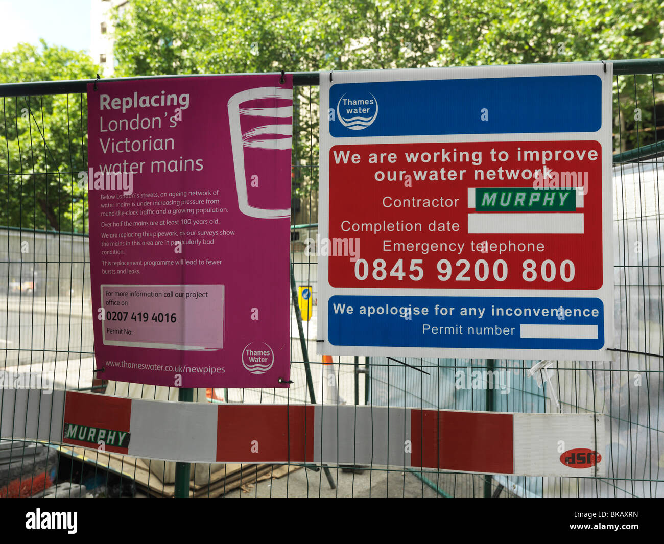 Signs Giving Notice Of Work Being Done To Replace London Victorian Water Mains England Stock Photo