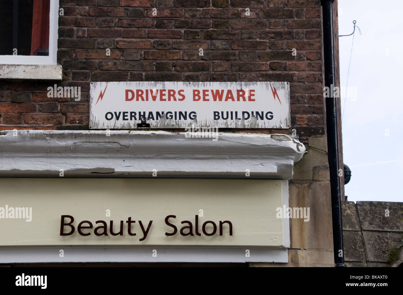 Warning of Overhanging Buildings in the historic centre of King's Lynn, Norfolk, England Stock Photo