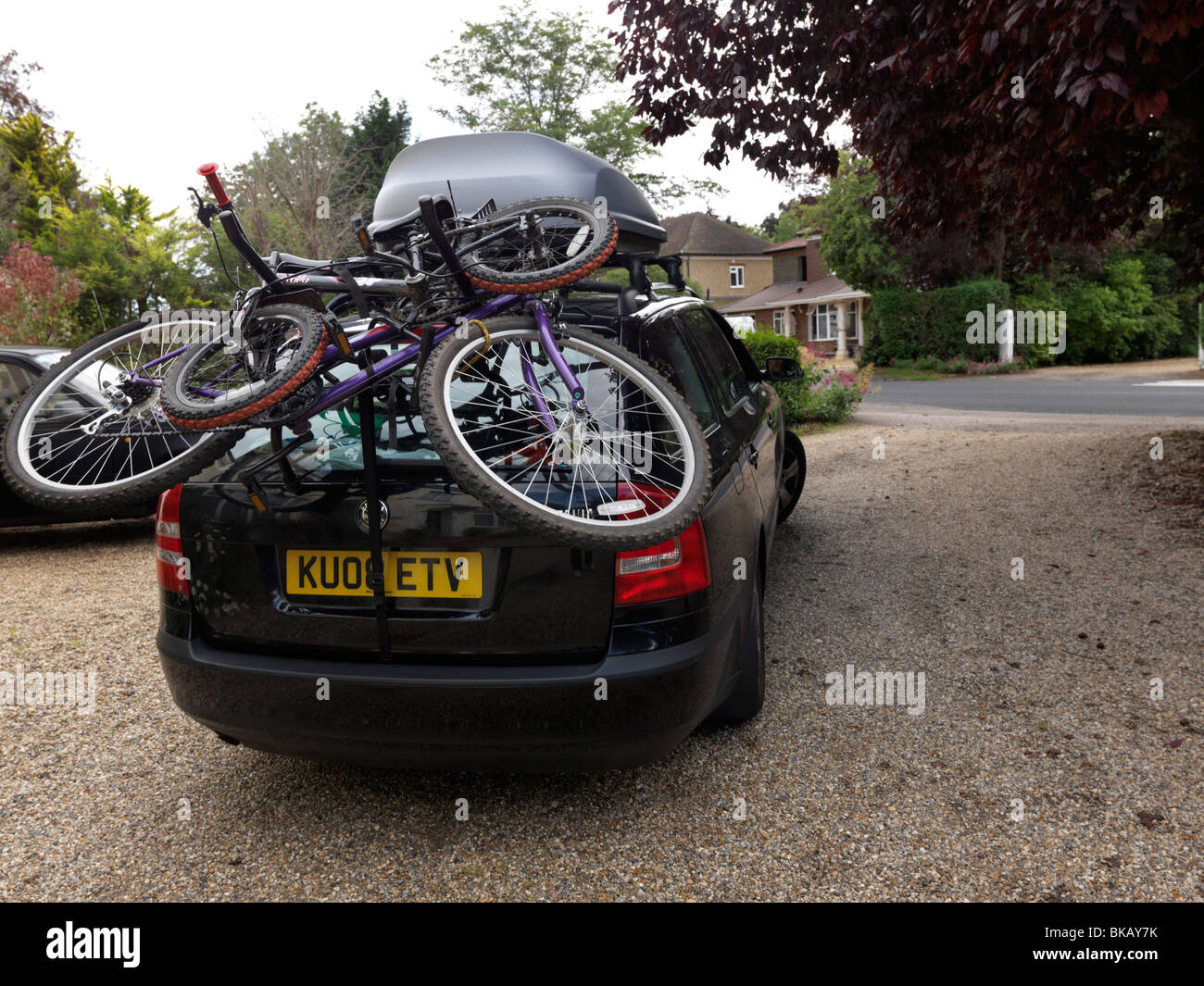 Car With Bicycle Rack And Top Box In Drive England Stock Photo Alamy