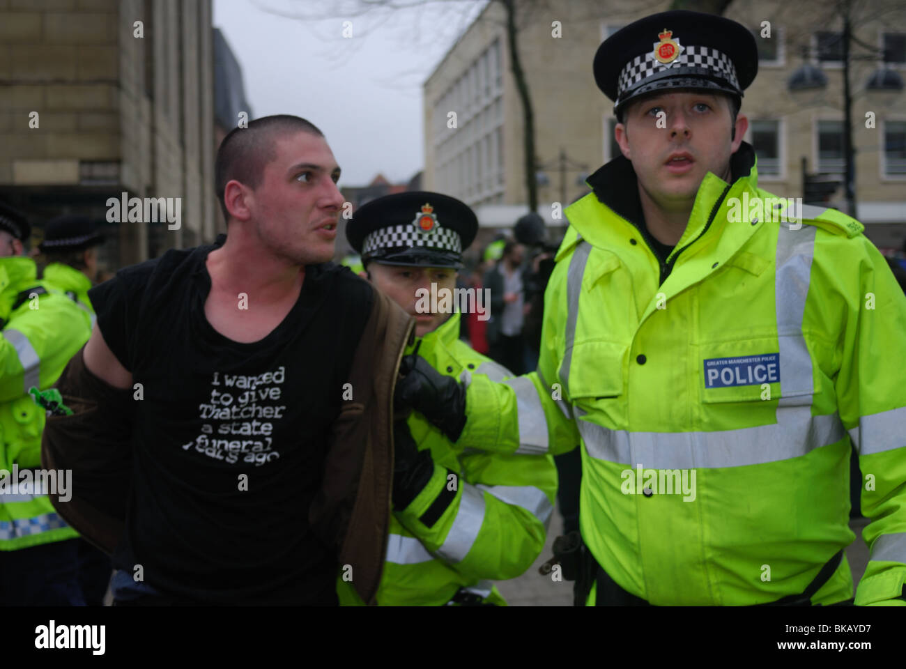 A Unite Against Fascism supporter is arrested by police at an English Defence League rally in Bolton. Stock Photo