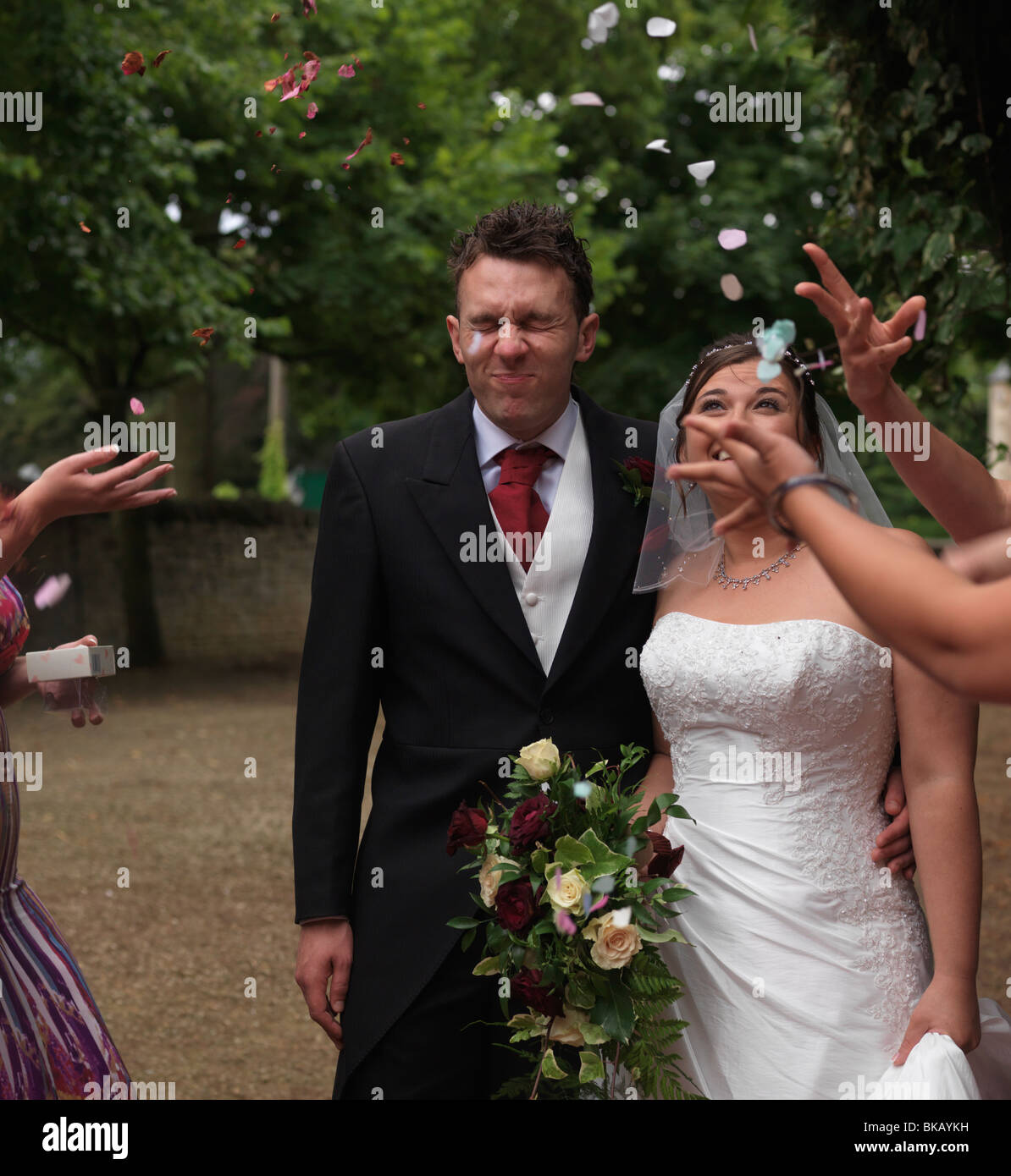Wedding Throwing Confetti Over Bride And Groom Peterborough England Stock Photo Alamy