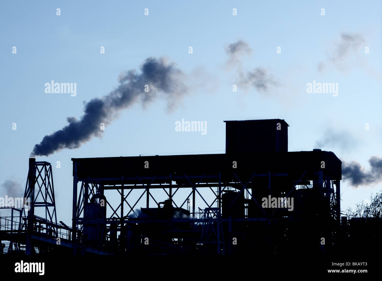 Backlight petrochemical industry smog smoke on sky Stock Photo - Alamy