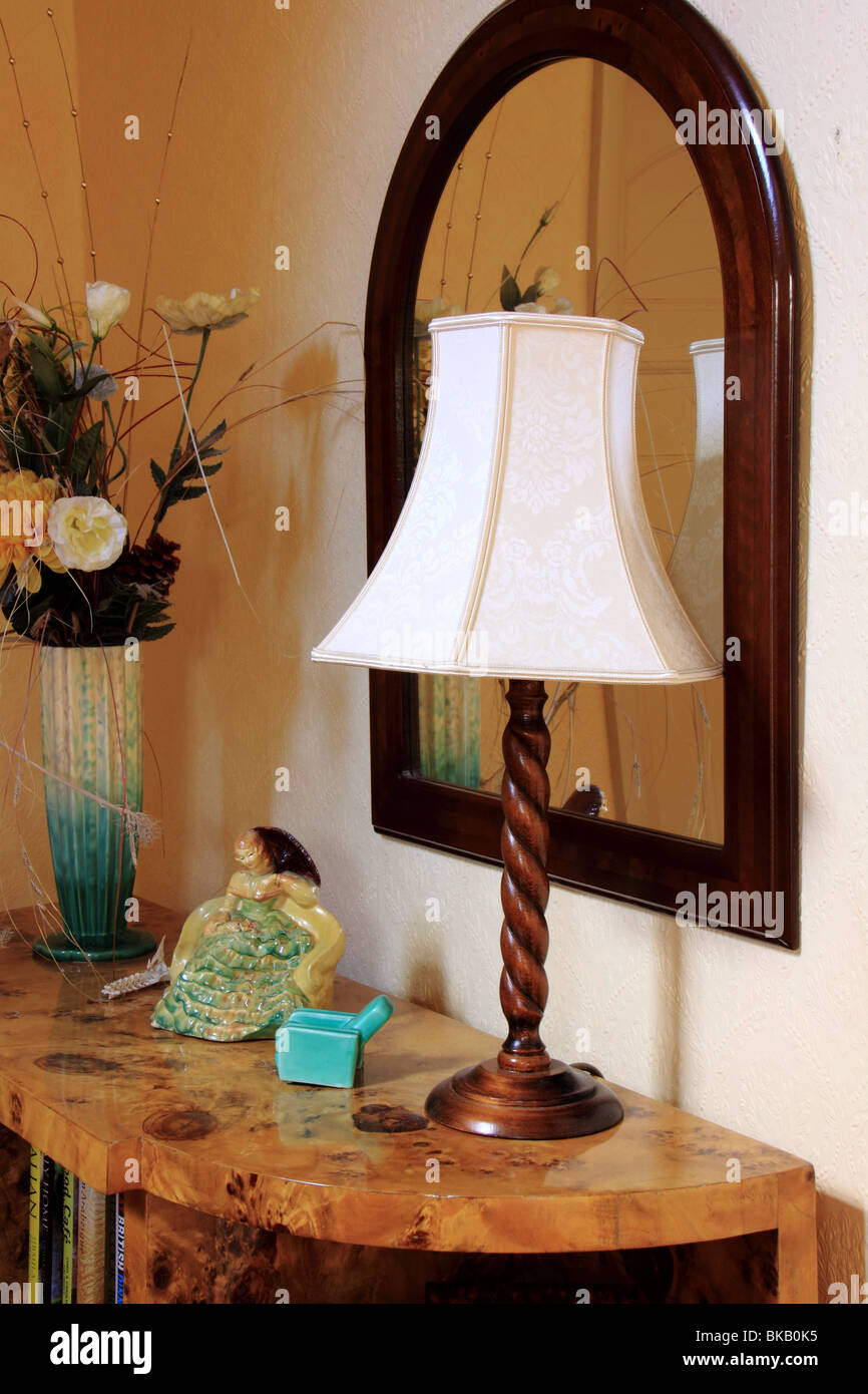 Art Deco bookcase with mirror and lamp Stock Photo Alamy