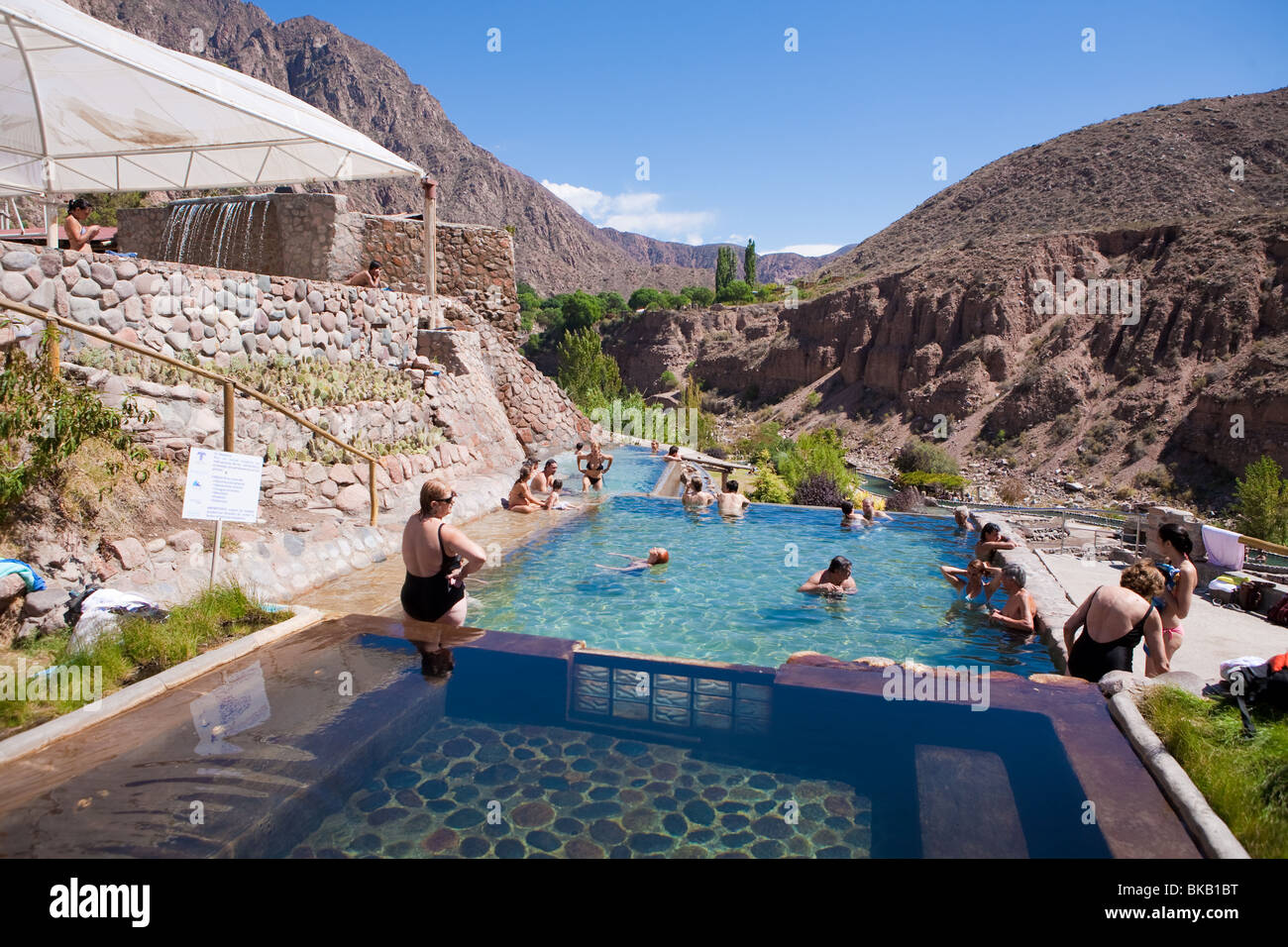 People enjoying in hot swimming pools in Cacheuta Thermal Springs Resort, Mendoza, Argentina Stock Photo