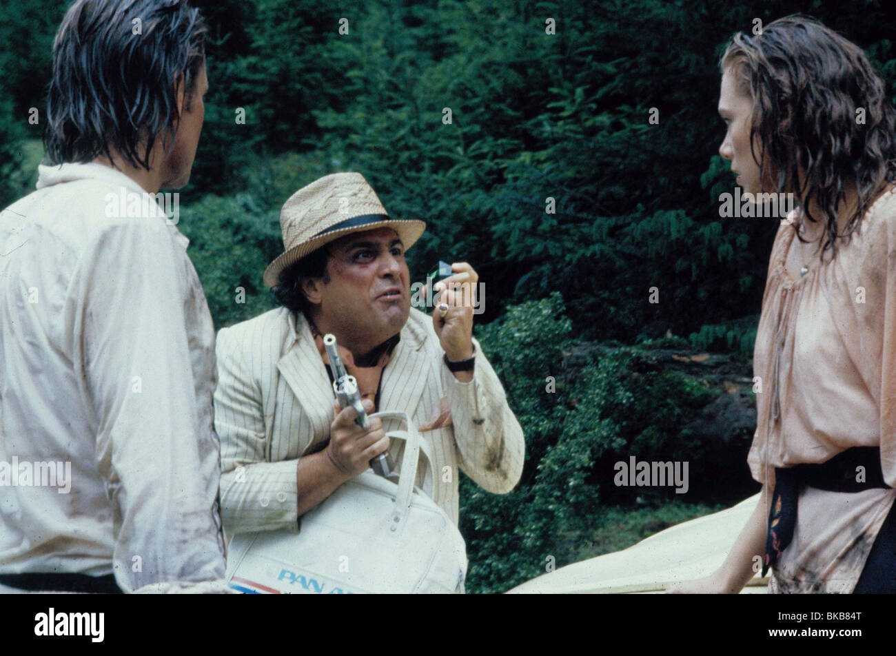 ROMANCING THE STONE (1984) MICHAEL DOUGLAS, DANNY DEVITO, KATHLEEN TURNER RMST 007 Stock Photo