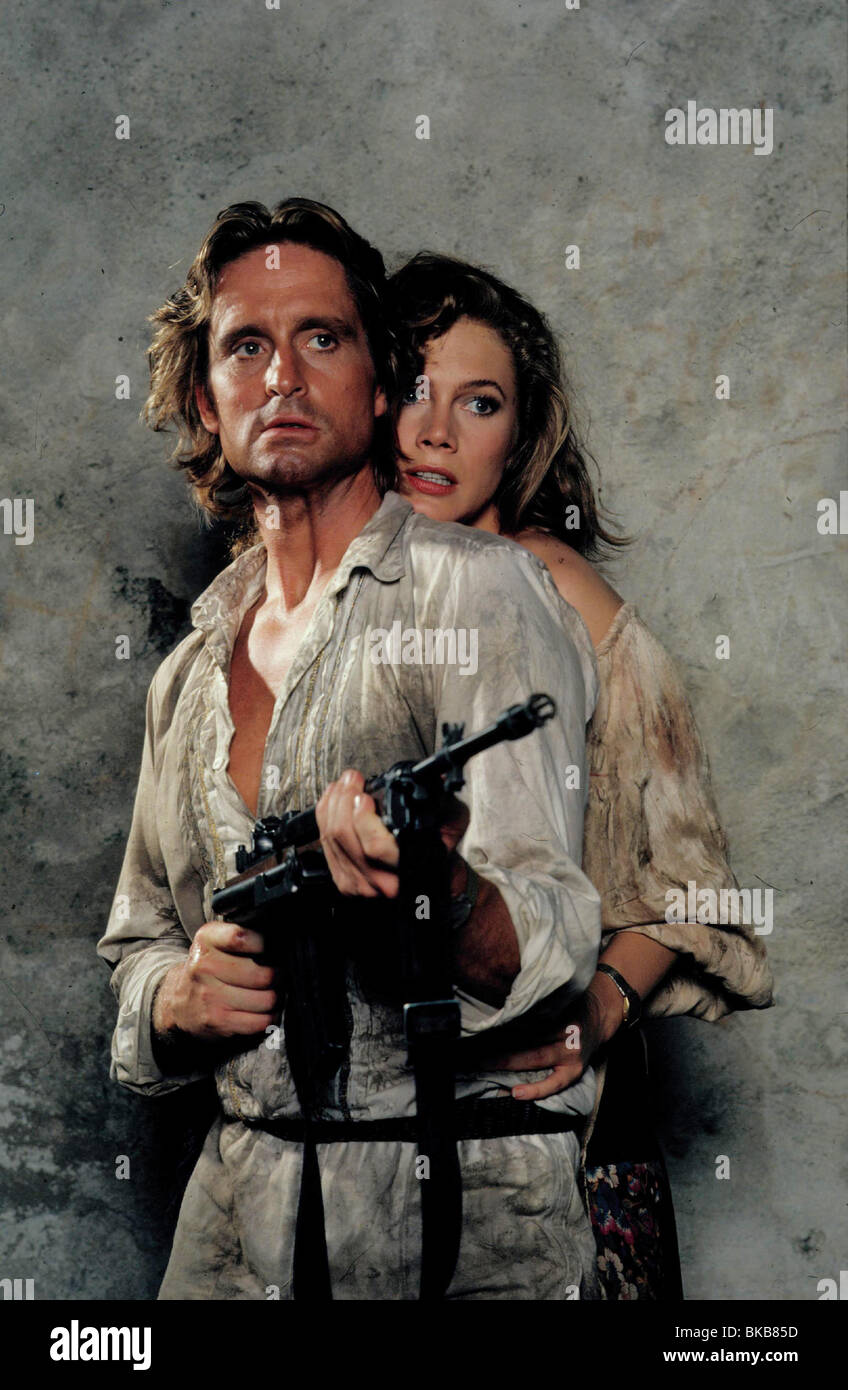 ROMANCING THE STONE (1984) MICHAEL DOUGLAS, KATHLEEN TURNER RMST 021 Stock Photo