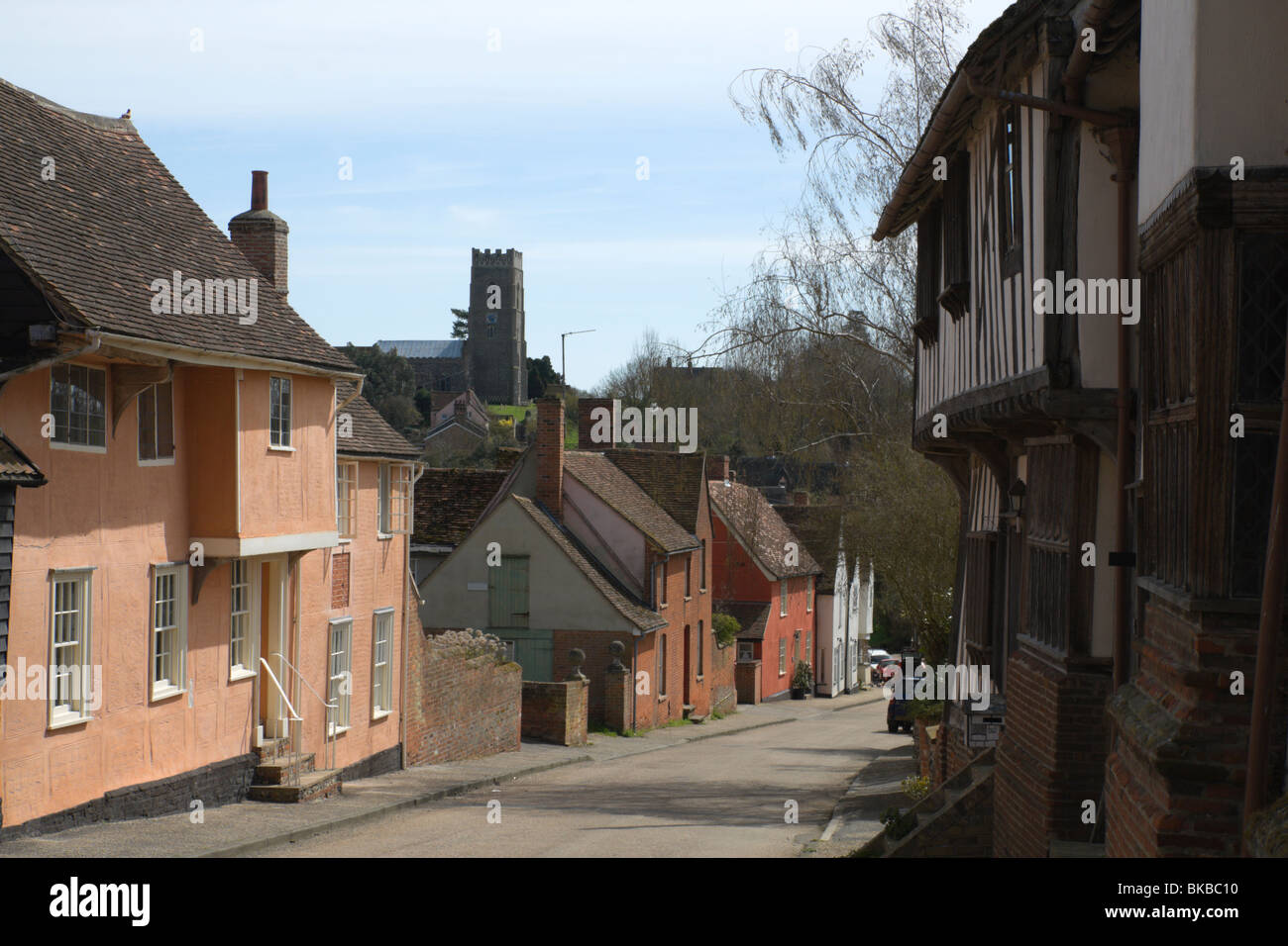 The church visible beyond the High Street in the village of Kersey