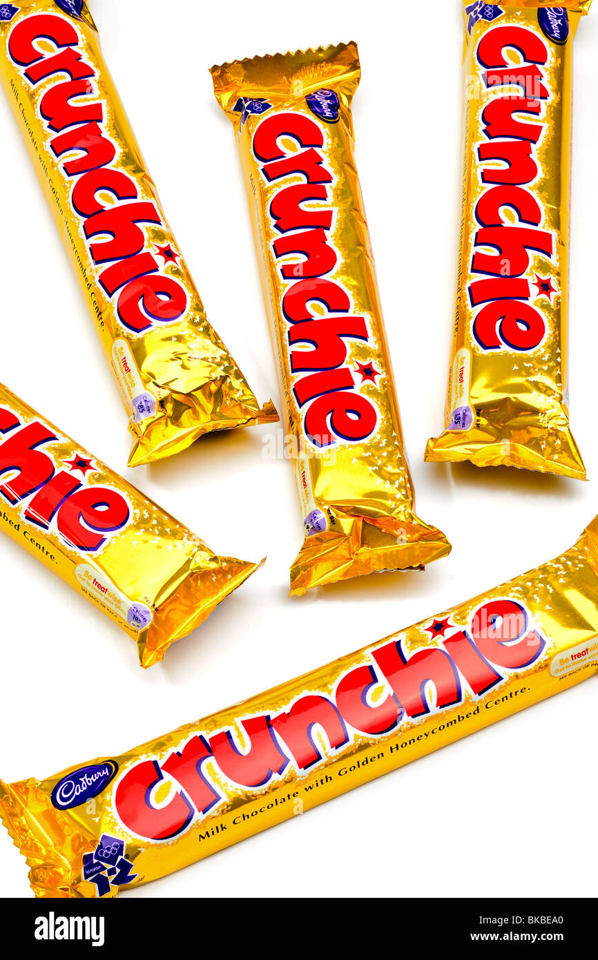Five individually wrapped Cadbury's Crunchie bars Stock Photo
