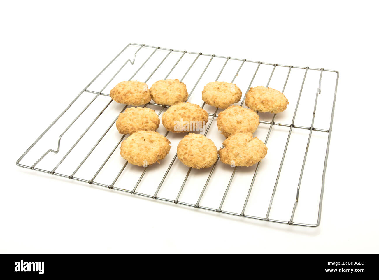 Home baked coconut cookies called melting moments from low viewpoint on cooling rack. Stock Photo