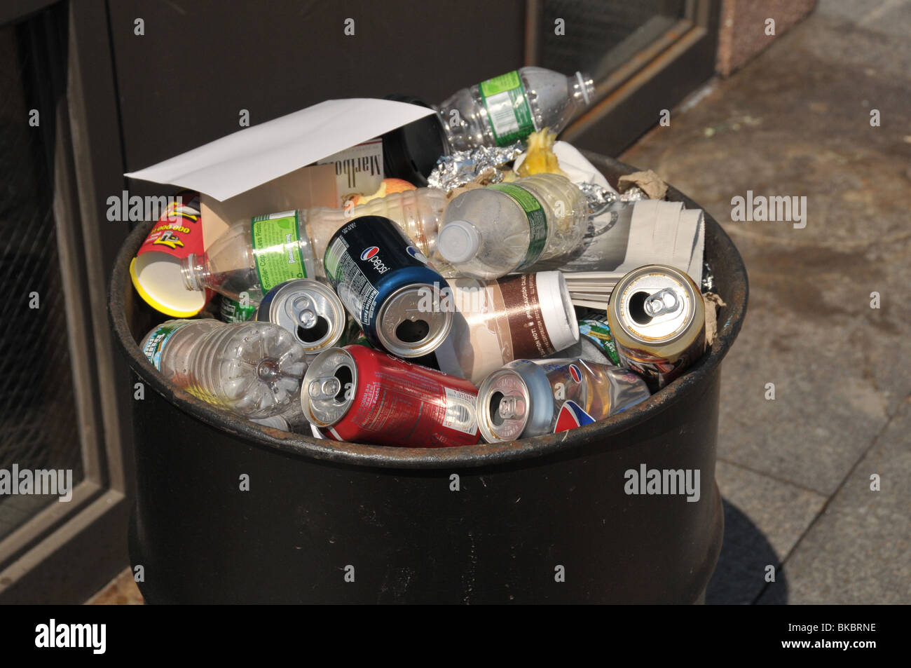 Recyclable bottles and cans in trash bin Stock Photo - Alamy