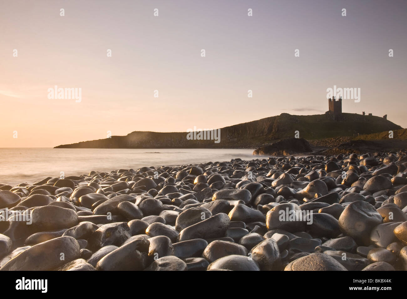 Dunstanburgh Castle viewed from Embleton Bay Stock Photo