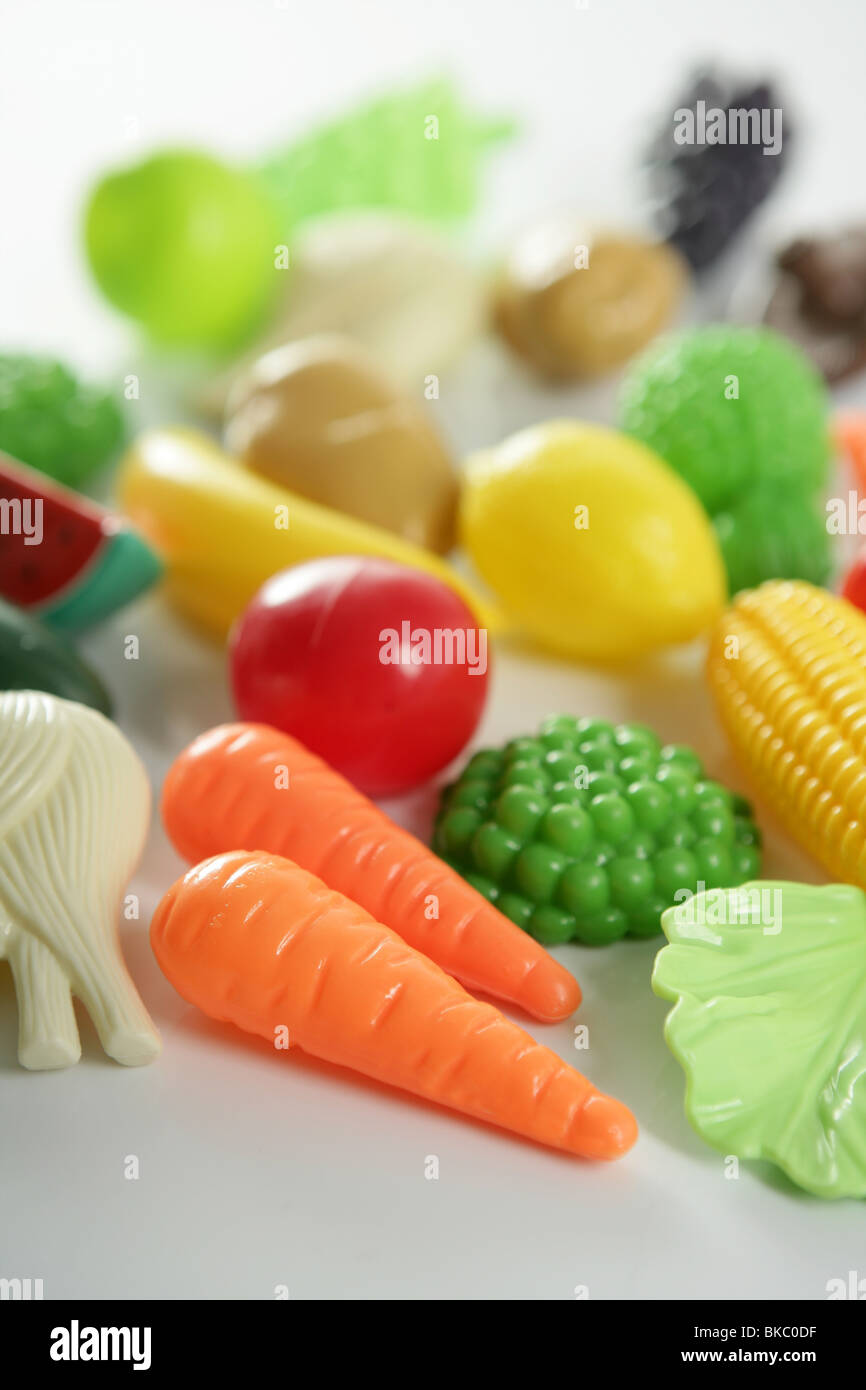Plastic game, fake varied vegetables and fruits. Children food