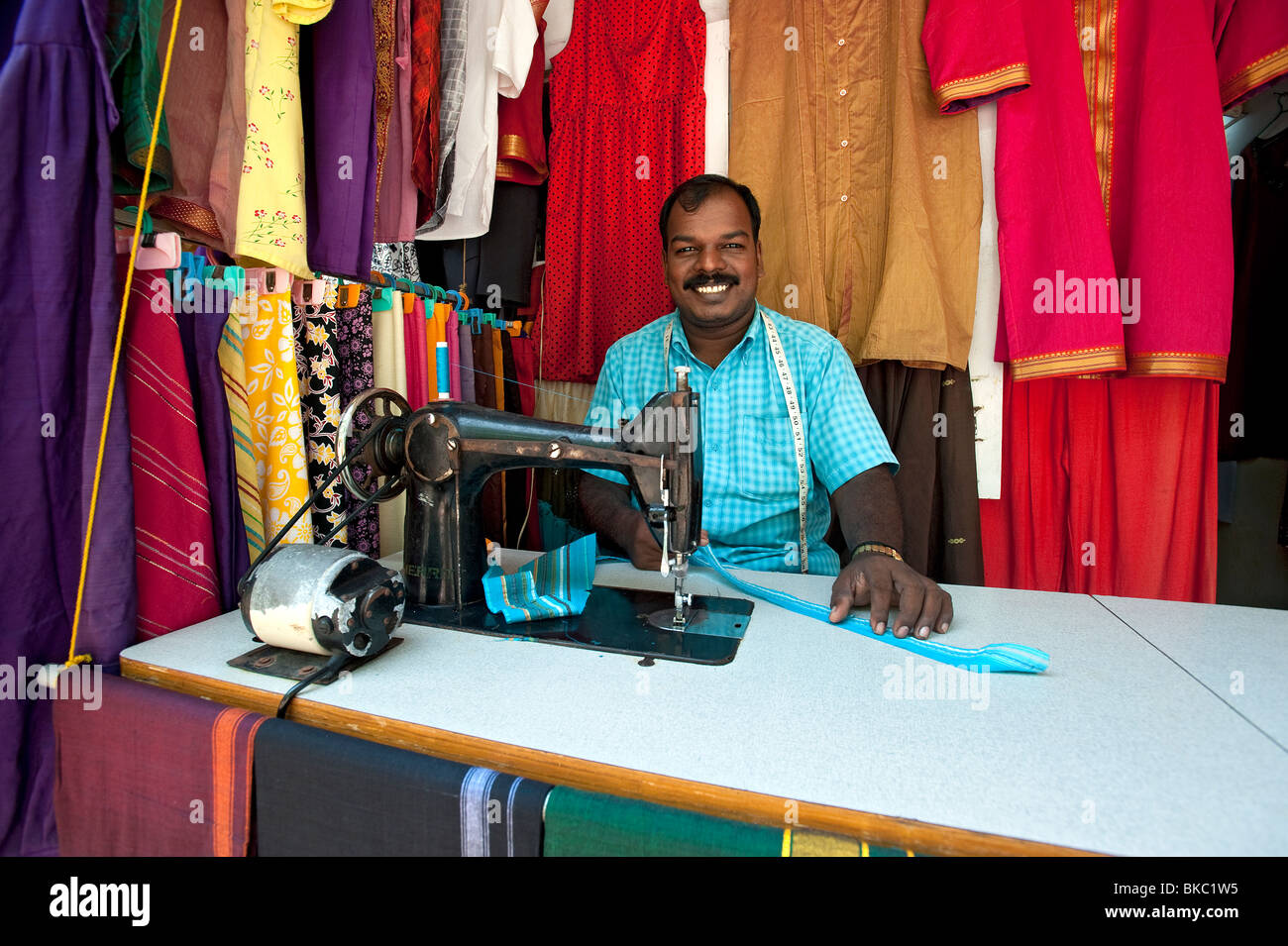 Local man in tailor shop, Kovalam, Kerala, India Stock Photo