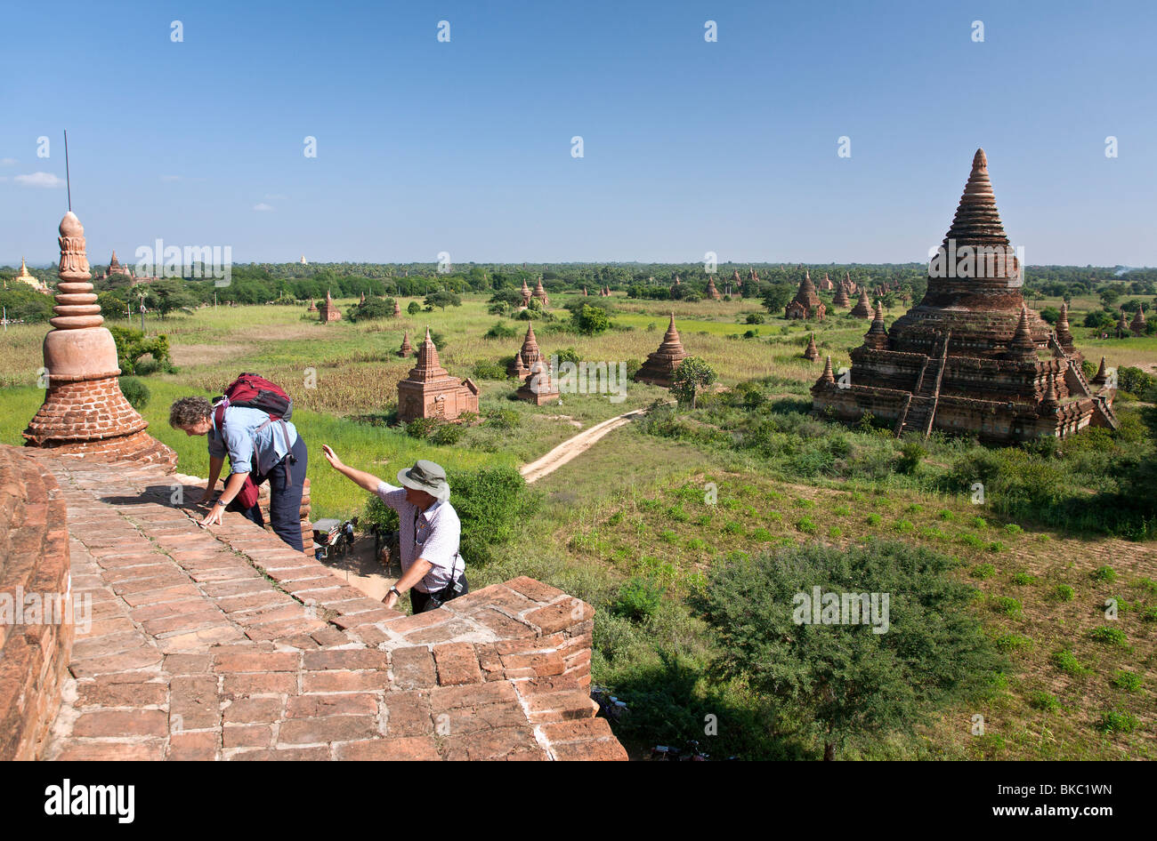 Tourists climbing to the top of a temple. Buledi Group. Bagan. Myanmar Stock Photo