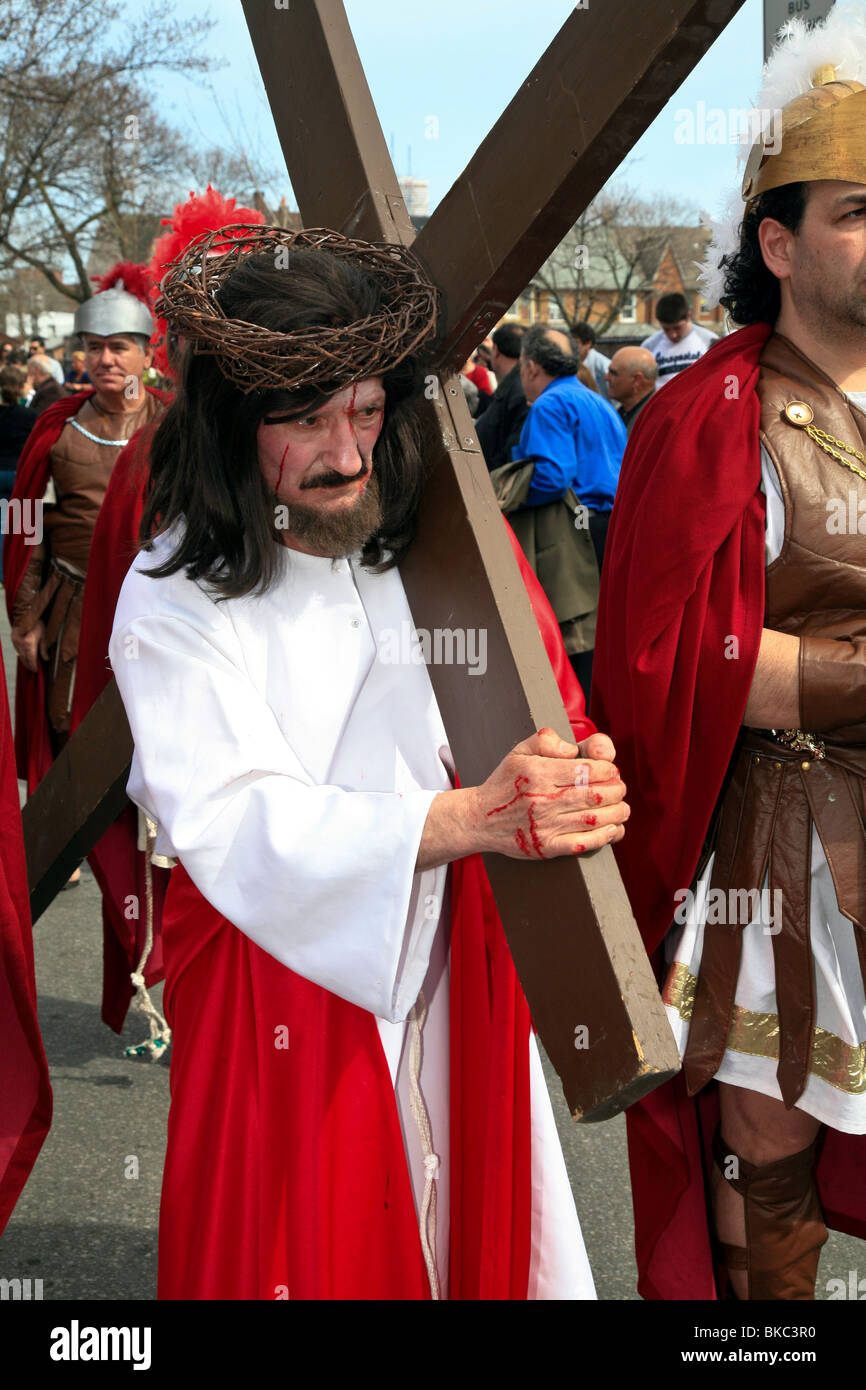Jesus (actor) carries cross at Holy Easter or Good Friday Procession Parade,' Little Italy', Toronto,Ontario,Canada, Stock Photo