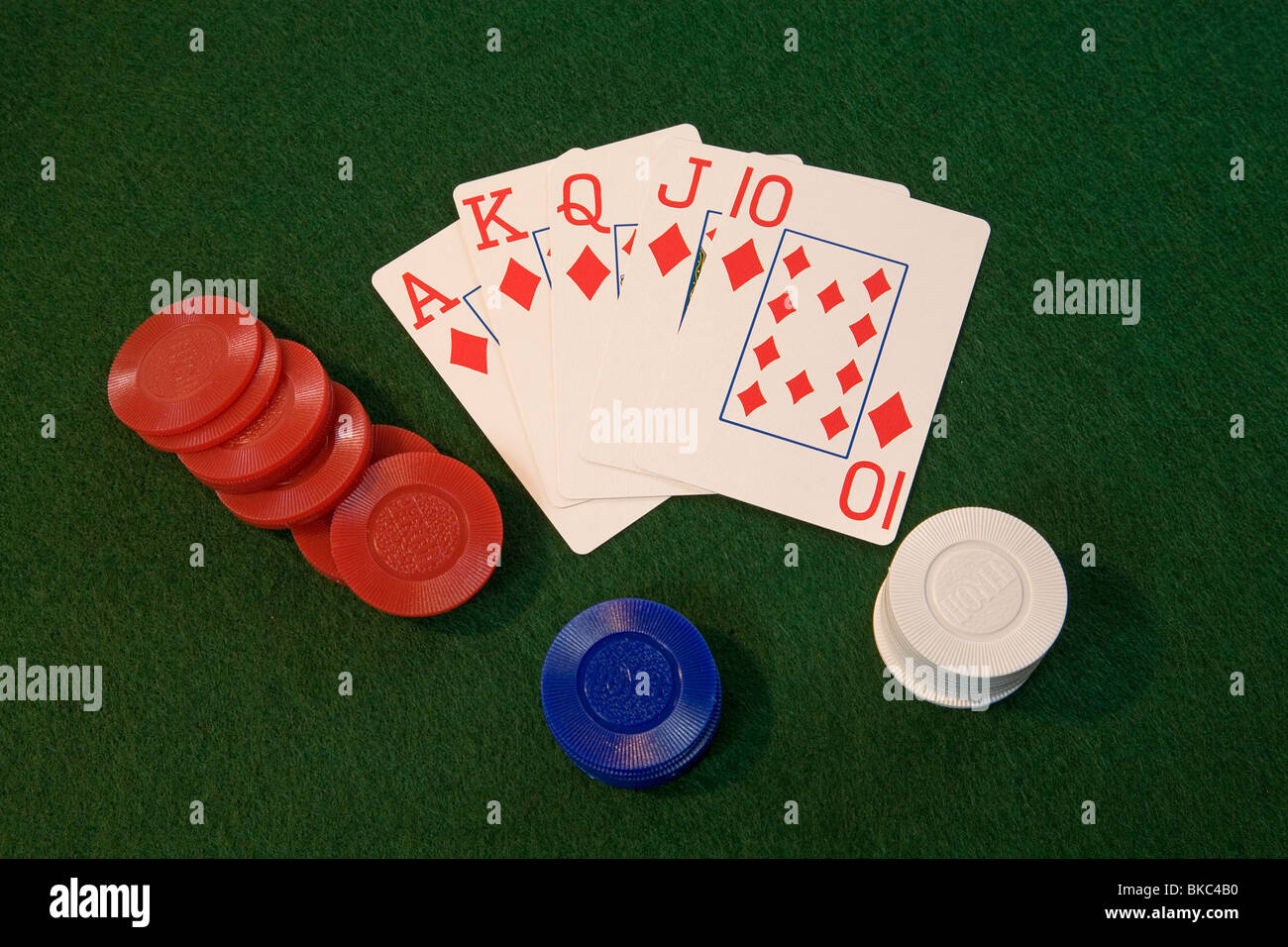 A royal flush poker hand in five card draw or stud poker with poker chips Stock Photo